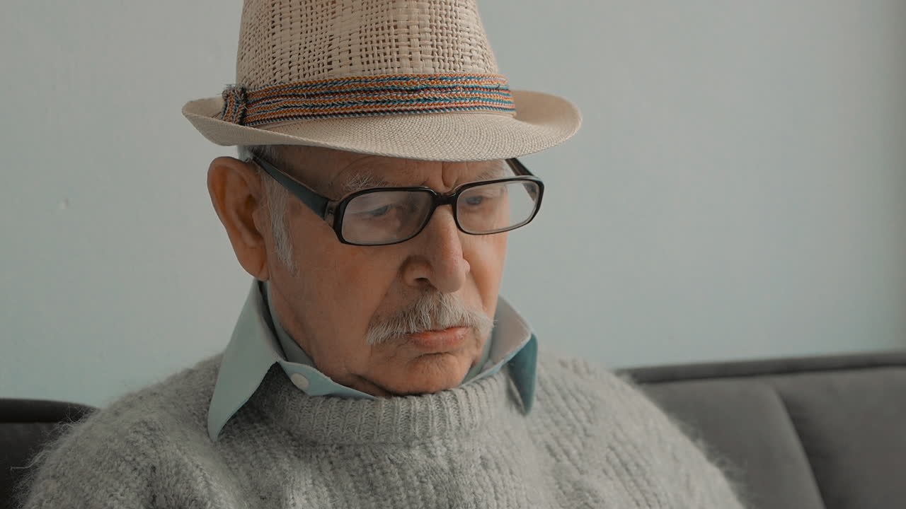 Free stock video - Portrait of elderly man reading