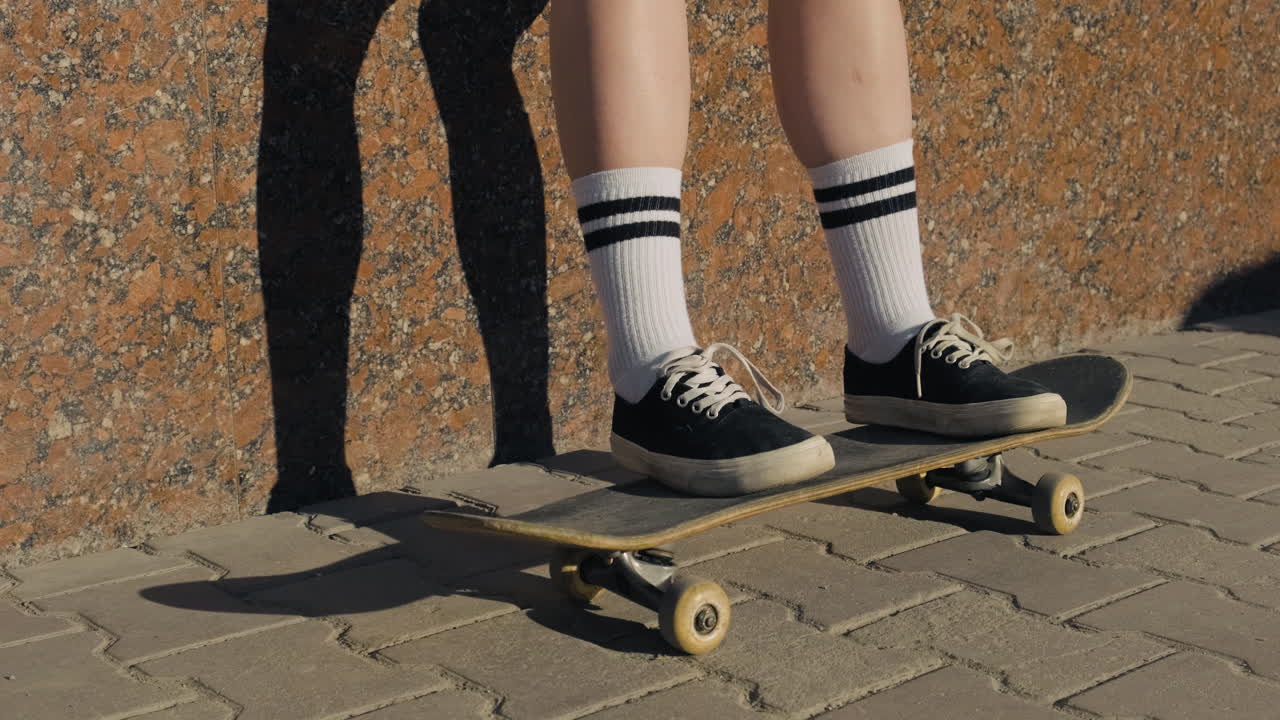 Free stock video - The feet of an unrecognisable skater girl on a ...