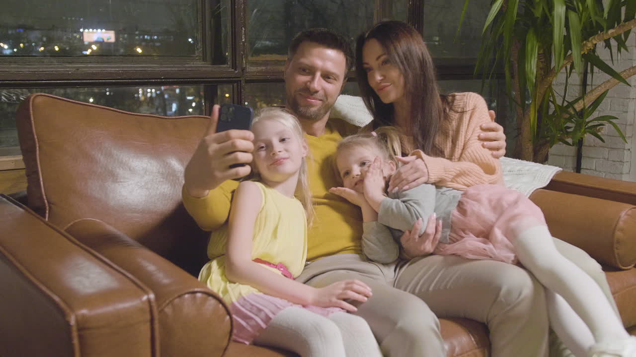 Free stock video - Happy parents and two little girls taking selfie ...